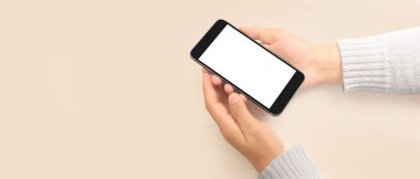 Hand holding smartphone device touching screen