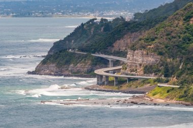 Sea Cliff Bridge, a balanced cantilever bridge built in 2005, curves around the coast of New South Wales in Australia connecting the towns of Clifton and Coalcliff