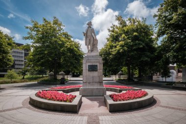 Christchurch, New Zealand - December 25th 2022: A statue of the explorer James Cook stands in Victoria Square in Christchurch, New Zealand. Cook was the first man to circumnavigate New Zealand in 1769
