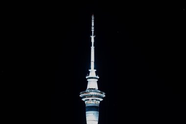 Auckland, New Zealand - December 27th 2022: The 328m tall Sky Tower in Auckland New Zealand lit up against the night sky
