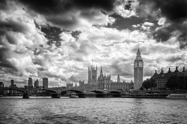 Westminster, London, England - 29th July 2023: Black and white image of Big Ben and the houses of Parliament and Westminster Bridge on the River Thames in London