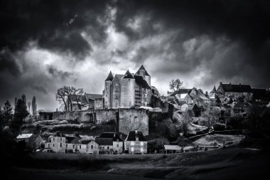 Salignac-Eyvigues, Nouvelle-Aquitaine, France - 11th March 2024: Black and white image of storm clouds over Chateau de Salignac which dates back as far as the 11th century clipart