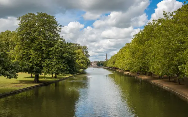 stock image The river Great Ouse on the Embankment in the county town of Bedford in Bedfordshire, England with the spire of St Paul's Church in the distance