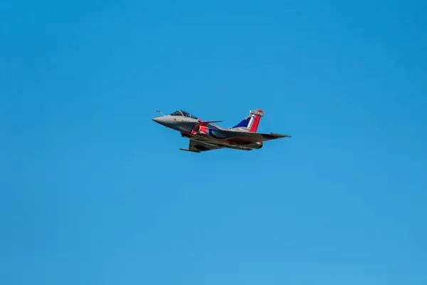 stock image Sarlat-Domme, Dordogne, France - 25th August 2024: The Rafale Solo Display in the livery of the 90th anniversary of the French Armee de l'Air & de l'Espace performs at the Sarlat-Domme Spectacle Aerien airshow