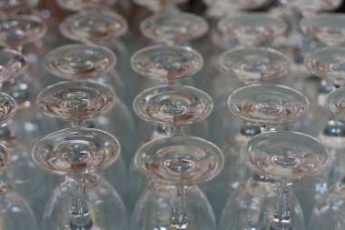 Empty wine glass stacked-up on one another in pattern photo