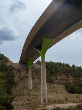 Below an elevated road. Closure of the base and lower part of the highway bridge. Bridge construction concept. Road architecture.