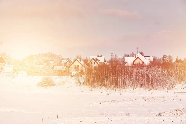 stock image A residential farm cottage in a natural rural area is covered with freshly fallen snow. Dwelling house in the winter.