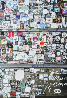 Hamburg, Germany, Europe 25.12.2022. The public transport stop on the street is covered with numerous multicolored stickers.
