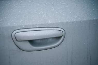 Frosted ice car door handle covered with ice crystals. the iced vehicle handle. Concept of a frosty morning