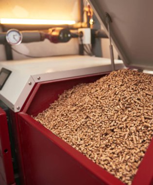 Pellet boiler system. Biomass heating systems generate heat from biomass. Renewable energy and sustainable future