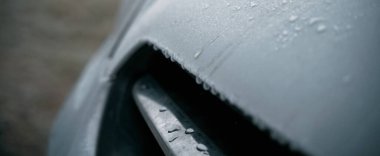 Frozen car on the outside parking. Transport in winter. Vehicle close-up with frozen windshield and windows.