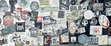 Hamburg, Germany, Europe 25.12.2022. The public transport stop on the street is covered with numerous multicolored stickers.