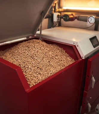Pellet boiler system. Biomass heating systems generate heat from biomass. Renewable energy and sustainable future