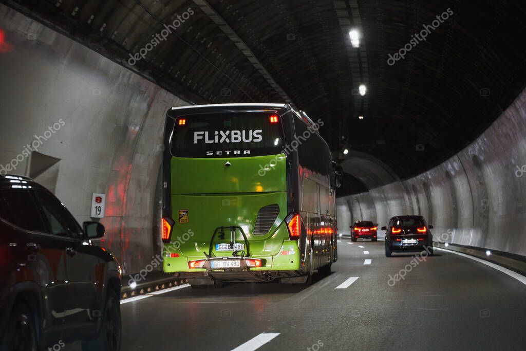 Europe, Switzerland - 14.04.2023: a Flixbus bus in the tunnel under Alps mountains. The Flixbus is a German brand offering intercity coach services in European countries and in the USA.