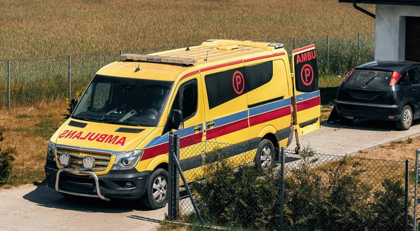 stock image Emergency Ambulance is Parked Outside. Front-Line Healthcare Services in Action. Ambulance truck on call in a suburbans.