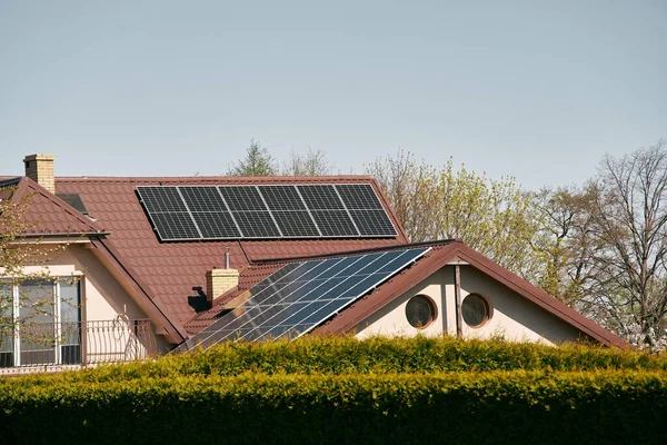Concept of sustainable future. Solar roof installation company. Solar Panels and Photovoltaic.