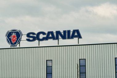17.04.2023 Germany. Europe. Scania logo on the factory warehouse. Truck production factory of the Scania company. Scania is a major Swedish manufacturer focusing on commercial vehicles clipart