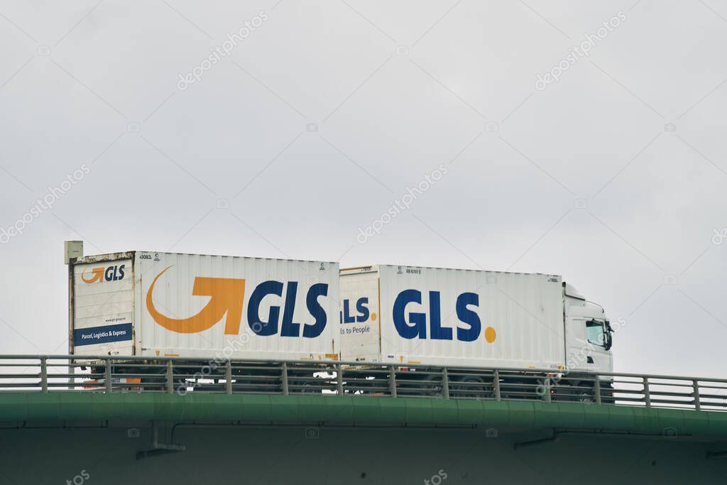 16.04.2023 Poland, Europe. GLS truck. General Logistics Systems, shortened to GLS delivery van speeding by countryside.