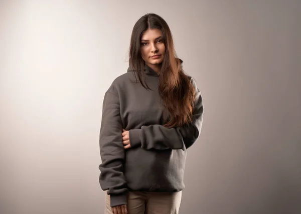 woman wears a plain hoodie. Clothes mockup for logo and branding