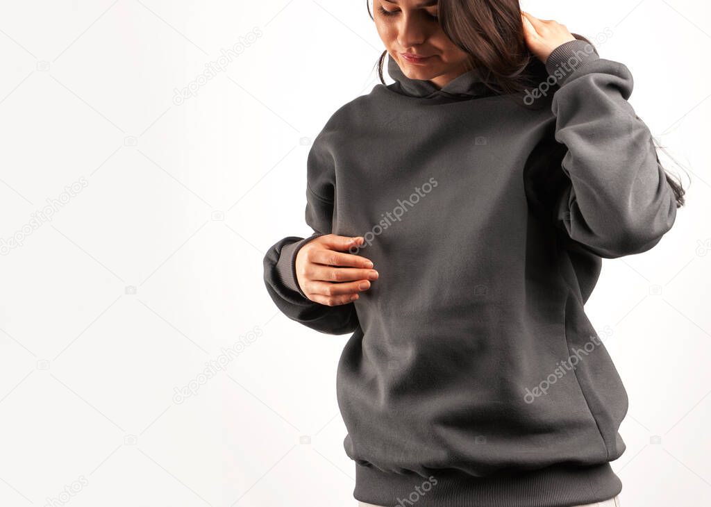 Woman wears a plain hoodie. Clothes mockup for logo and branding