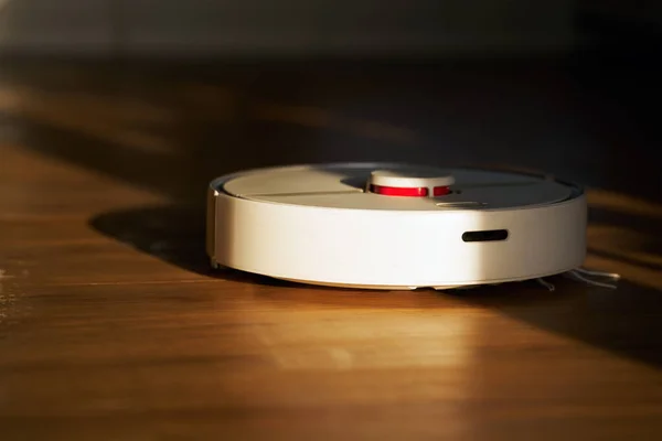 Robotic Vacuum Cleaner. Smart Home Cleaning for Wet and Dry Floor cleaning. Smart and sustainable house future. Robot sweeper.