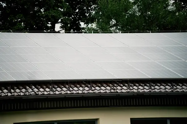 Solar Panels Powering a Sustainable Future. Modern Home with Photovoltaic Panels.