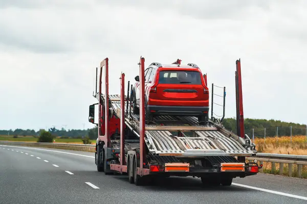 Reliable Towing and Recovery Services: 24-7 Assistance for Vehicle Breakdowns and Accidents. Emergency roadside assistance on the highway. side view of the flatbed tow truck