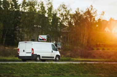 White van. Delivering to Suburban Homes. Commercial Van on the Road Cargo Delivery in the Countryside. Light-Duty Truck in Action. clipart