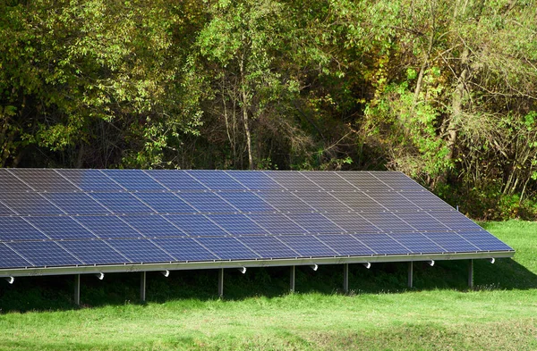A set of photovoltaic panels mounted on the ground. Solar energy panels outdoors. Solar Park.