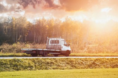 A truck transports cargo containers transported on land with semi trailers. Highway shipping and post delivery. Global commerce and industry that uses sustainable efficient logistics systems.