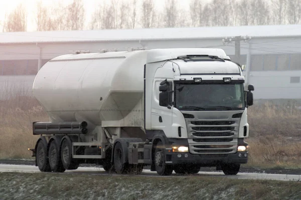 A Tank Truck Carrying LPG Gas on a Snowy Highway: A Transportation Service for Dangerous Goods