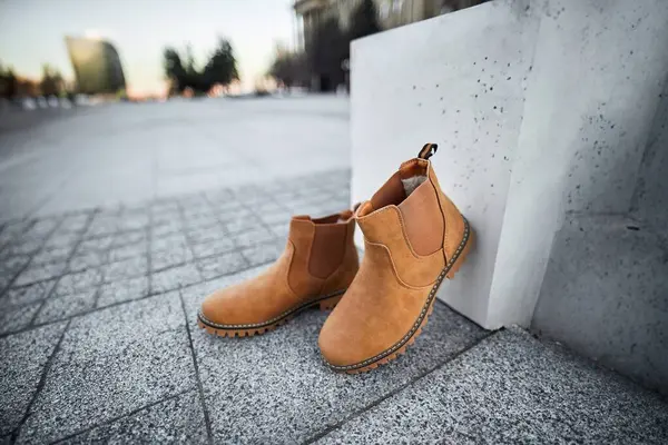Suede winter shoes for men. Walking the City Streets in Comfort and Style with Modern Suede Leather Boots. Brown Boots.