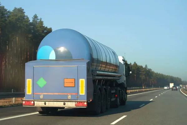 Fuel oil carrier truck driving on highway. It transports gas and lpg.