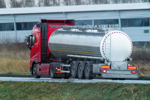 Oil and gas delivery truck on highway. It hauls fuel and lpg.