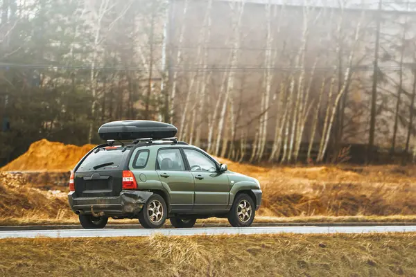 Exploring in Comfort. Family Car with Spacious Roof Rack Box