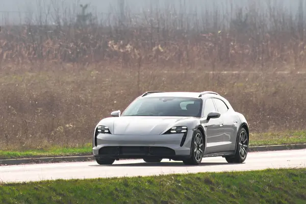 Electric Car Glides Down the Road in a Display of Modern Efficiency and Style
