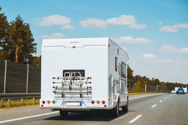 Caravan car travels on the highway.