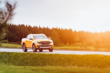 Countryside Cruise in Orange Pickup at Sunset