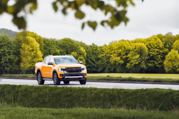 stock image Countryside Cruise in Orange Pickup at Sunset