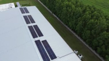 Green energy solar panels on an industrial building roof Sunlight powers the future