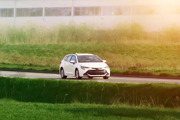 stock image White Modern Family Car Driving on Rural Highway