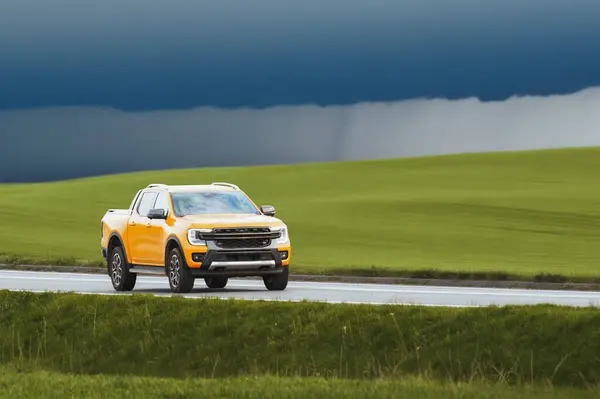 Stock image Sunset Journey in Orange Truck Along Country Path