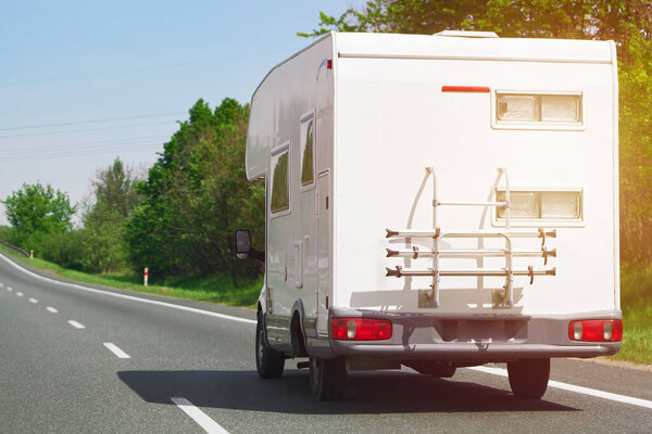 Caravan car travels on the highway.
