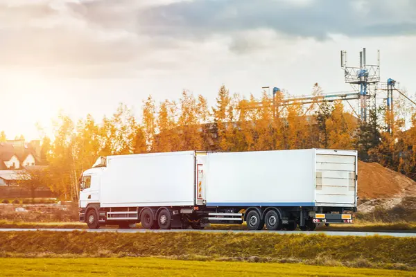 stock image Cargo truck driving on sunny highway