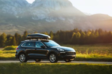 Expensive Black SUV with Roof Rack for Adventure Travel clipart