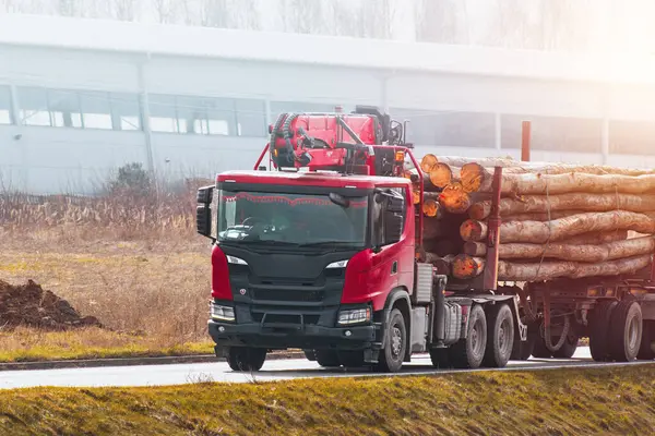 stock image truck hauling timber logs on rural road