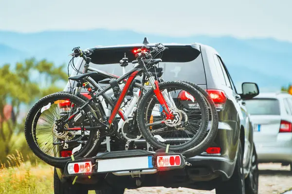 stock image Car with two bicycles on rear rack