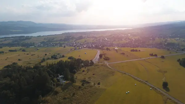 stock image Aerial panorama of Lake Czorsztyn with lush green hills