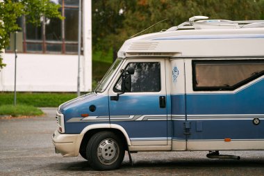 Old-fashioned RV parked in a serene landscape. 20.09.2023 Norway, Europe. clipart