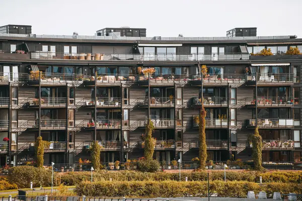 stock image Modern apartment building with balconies and greenery